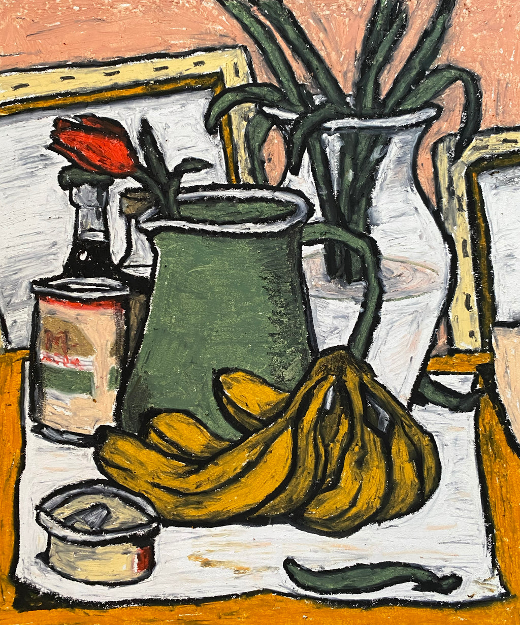 A rose in a pitcher at the studio