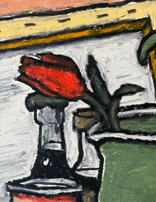 A rose in a pitcher at the studio